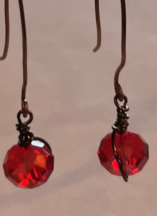 RED BEADED EARRINGS, ANTIQUE BRONZE HAND WRAPPED WIRES.