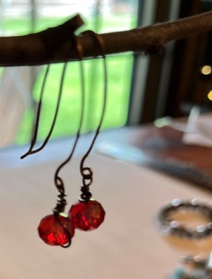 RED BEADED EARRINGS, ANTIQUE BRONZE HAND WRAPPED WIRES.